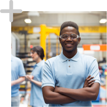 man with glasses on standing witn his arms crossed